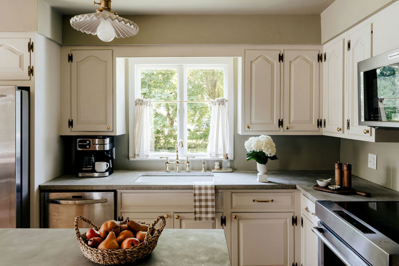 A freshly cleaned kitchen with gleaming countertops and organized surfaces